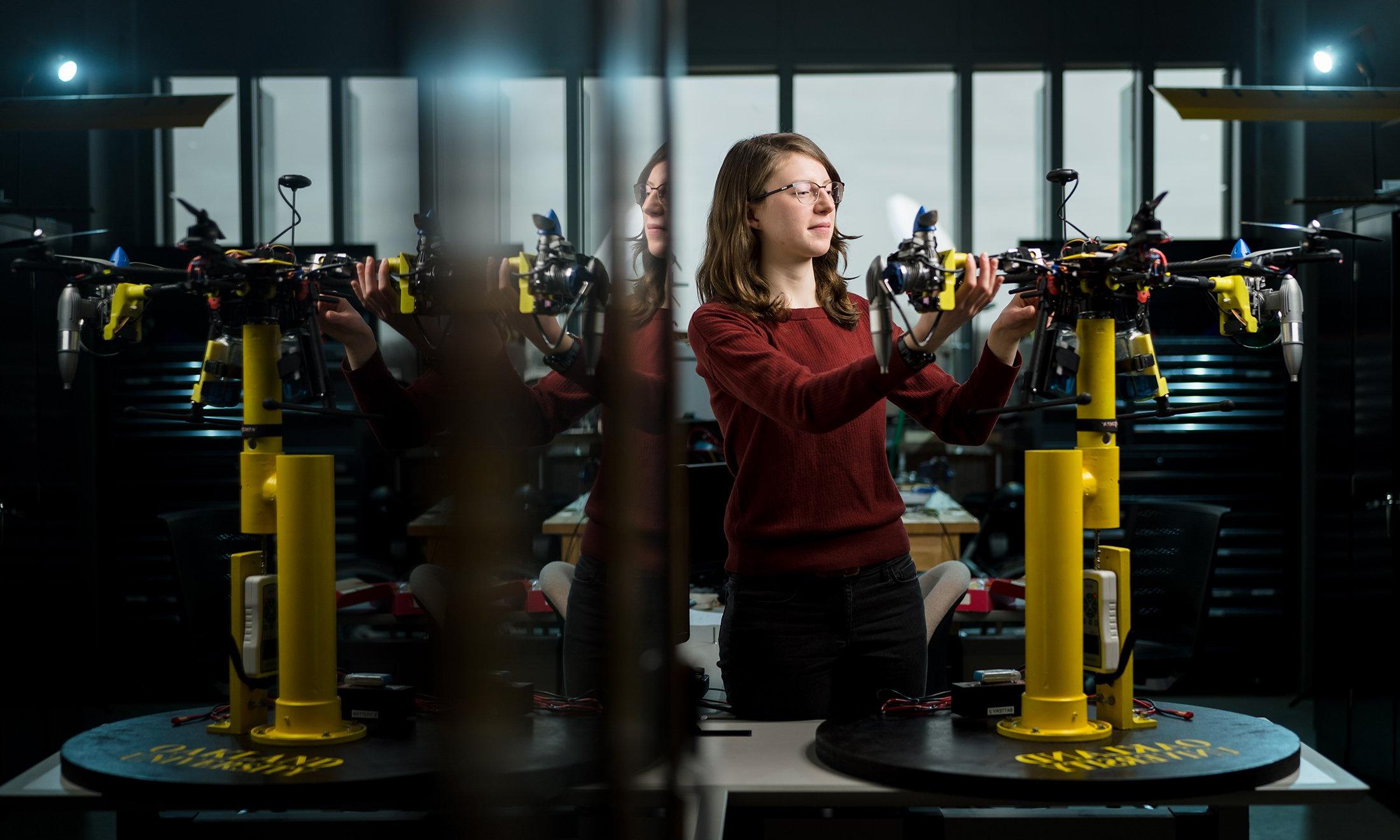 A woman working on drone.