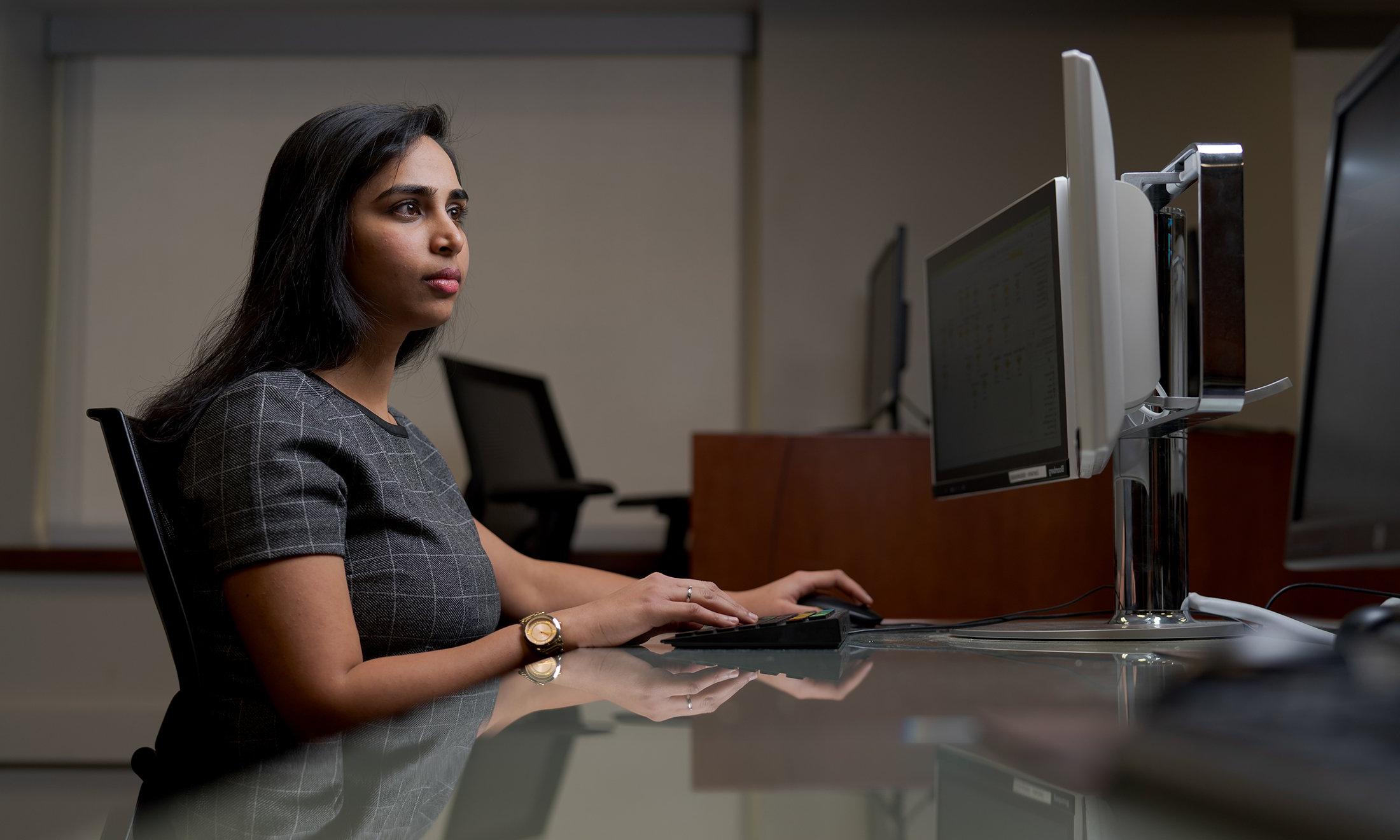 A woman sitting at a computer.