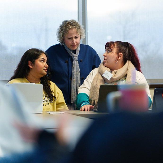 A professor talking to students