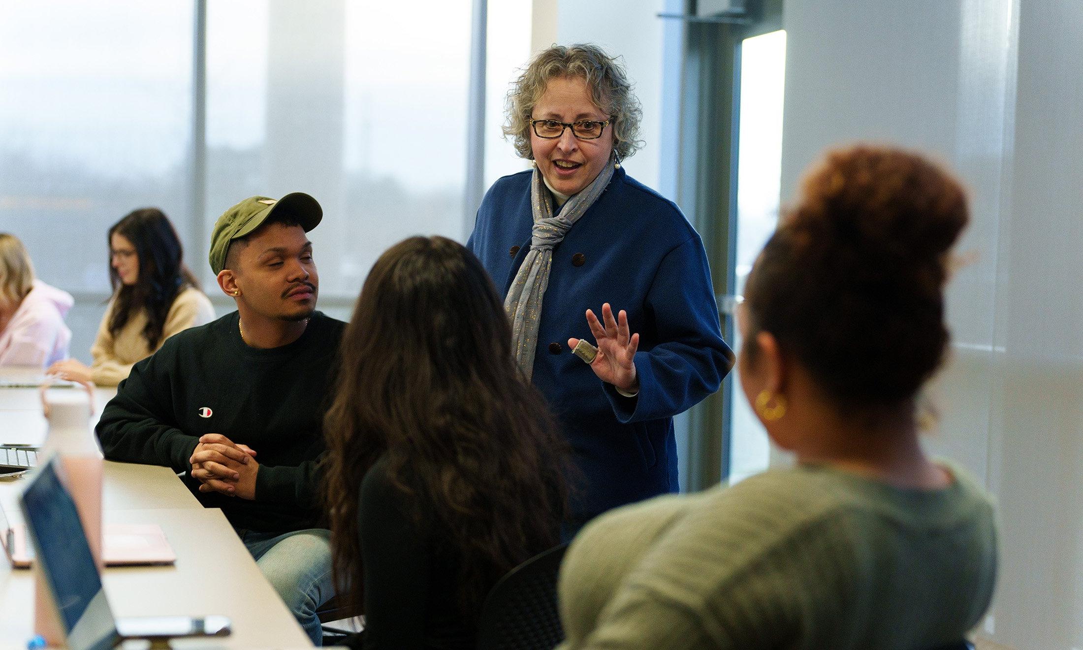 A professor talking to students