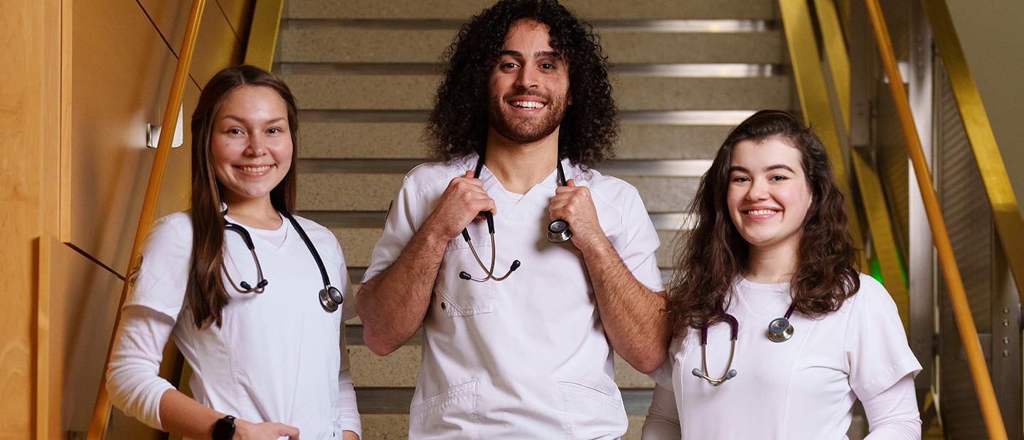 students wearing white lab coats